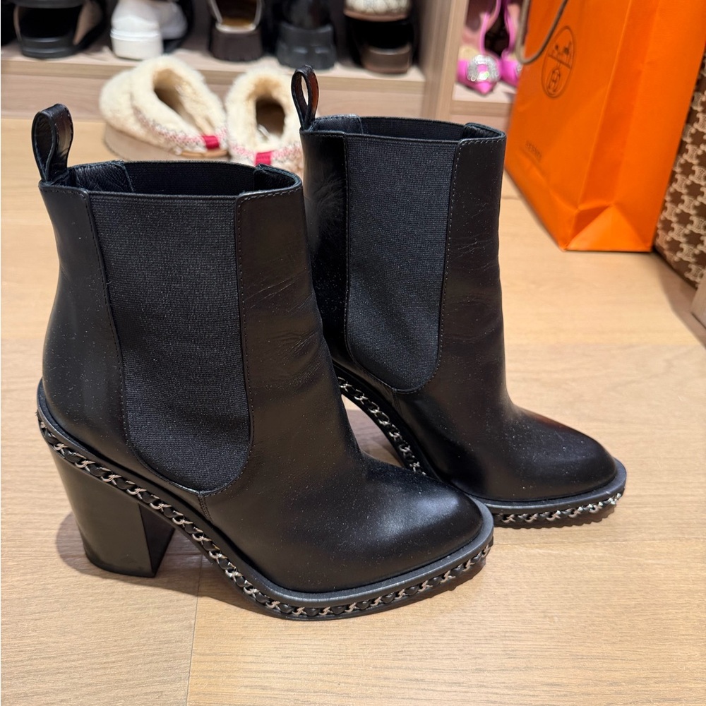 CHANEL Black Heeled Boots with Chain Accent